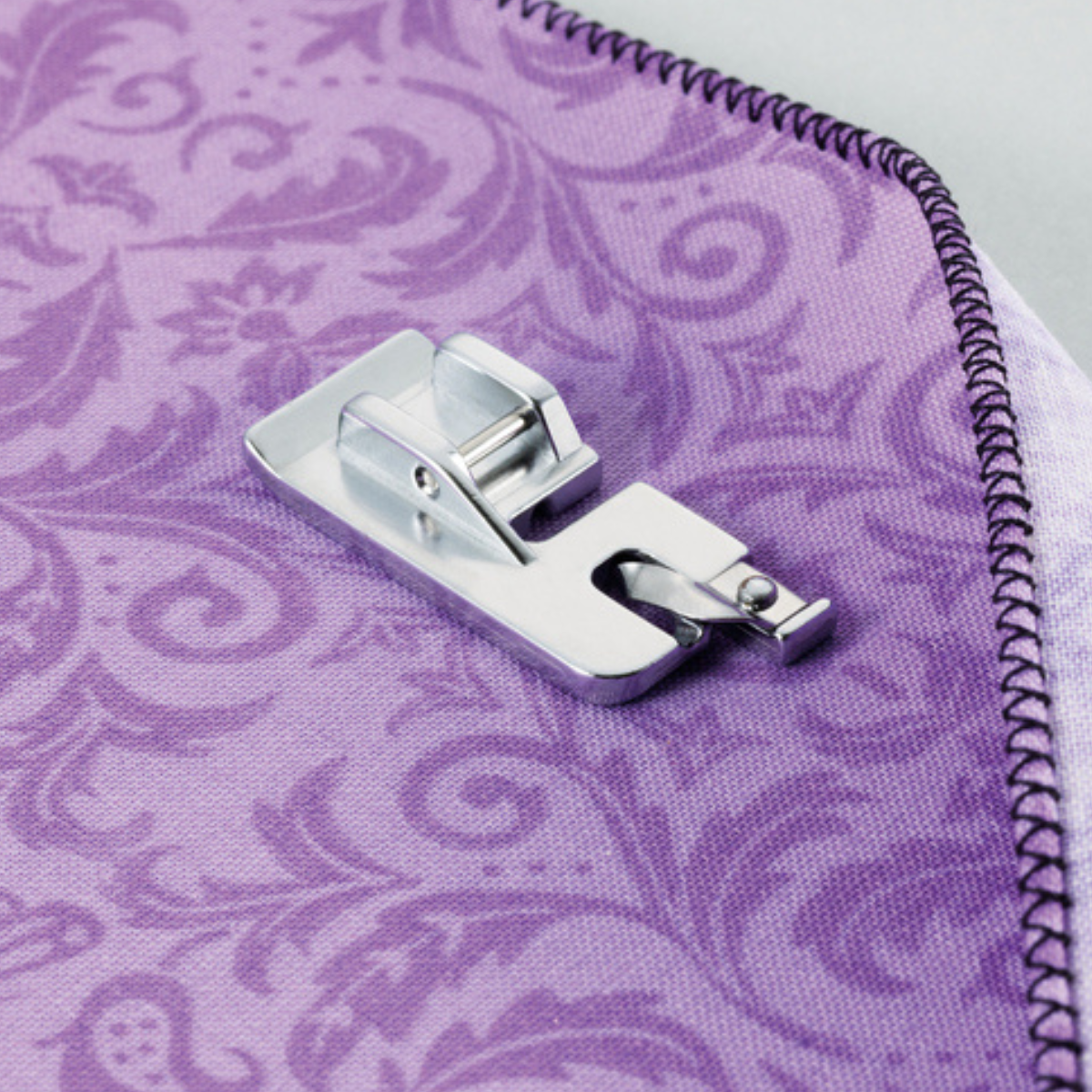 Piedino per Festoncino Orlo Tondo arrotolato Brother